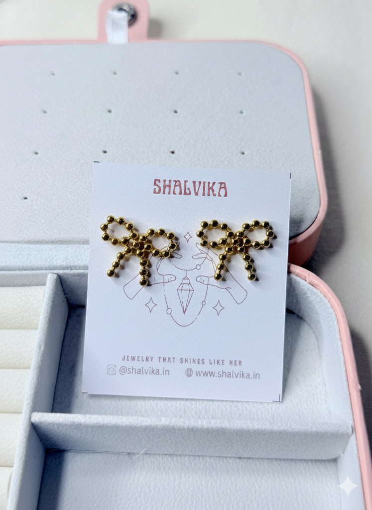 Orb bow earrings